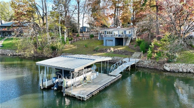 dock area featuring a lawn and a deck with water view