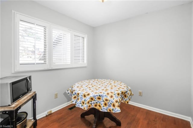 living area with hardwood / wood-style flooring