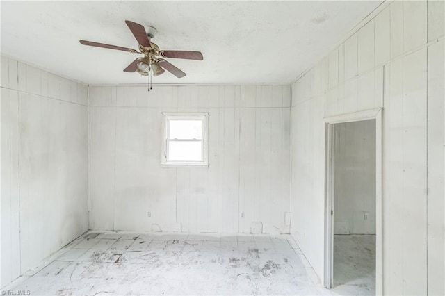 empty room featuring ceiling fan