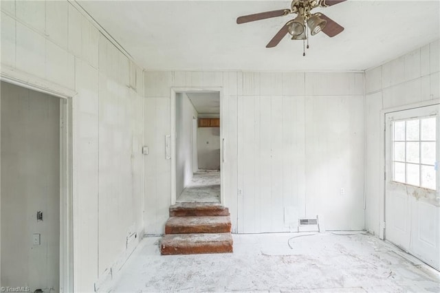 empty room with visible vents and a ceiling fan