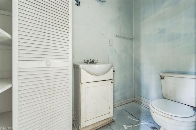 bathroom featuring toilet and vanity
