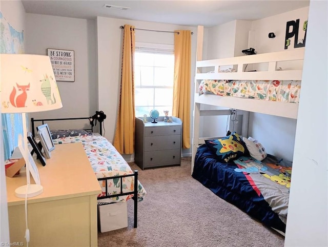 bedroom featuring visible vents and carpet