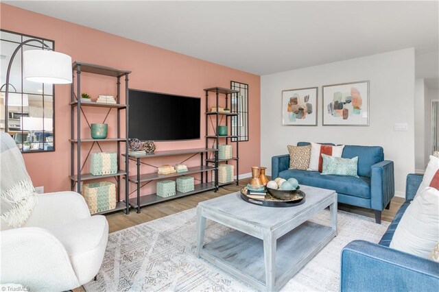 living room with light hardwood / wood-style flooring