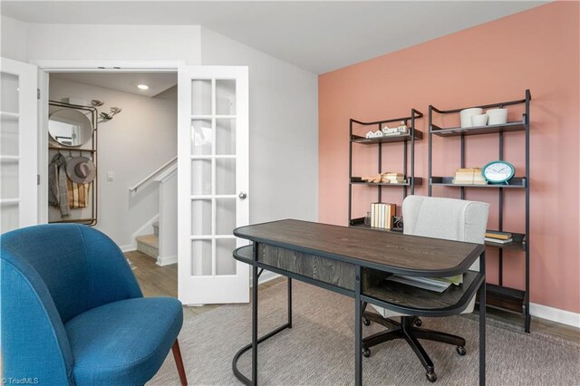 office space featuring french doors and hardwood / wood-style flooring