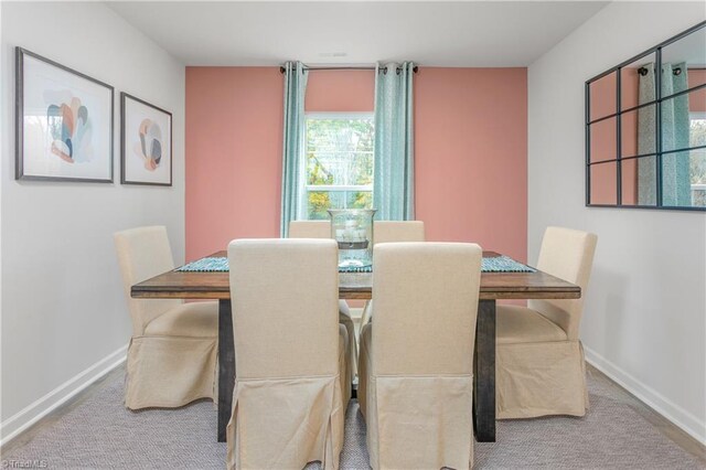 view of carpeted dining area