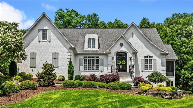 2550 Mountain Lake Rd, Asheboro, NC 27205 - french country home with a front lawn, brick siding, and roof with shingles