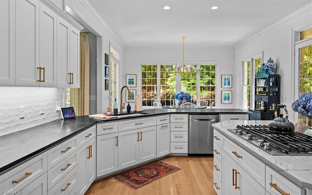 2550 Mountain Lake Rd, Asheboro, NC 27205 - kitchen with appliances with stainless steel finishes, light wood-style floors, tasteful backsplash, crown molding, and white cabinets