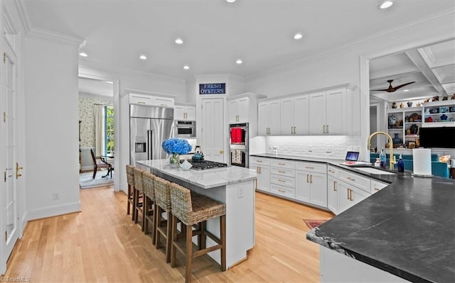 2550 Mountain Lake Rd, Asheboro, NC 27205 - kitchen with crown molding, white cabinets, recessed lighting, a kitchen bar, and backsplash