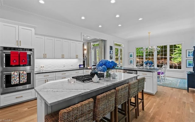 2550 Mountain Lake Rd, Asheboro, NC 27205 - kitchen featuring stainless steel appliances, a peninsula, ornamental molding, recessed lighting, and a center island