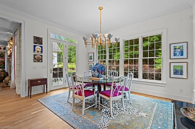 2550 Mountain Lake Rd, Asheboro, NC 27205 - dining area with wood finished floors, ornamental molding, a chandelier, and french doors