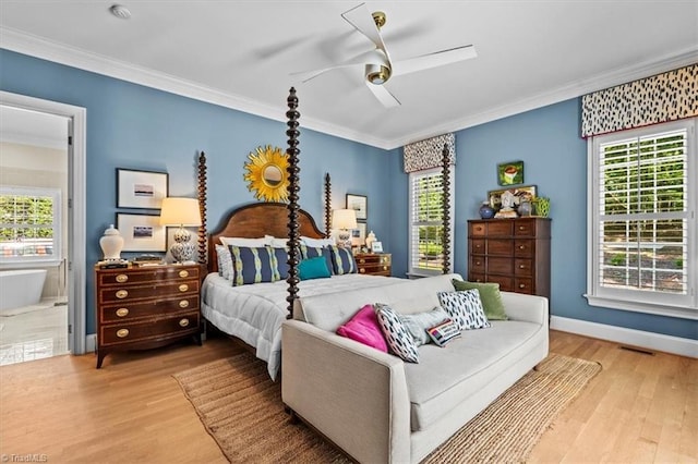 2550 Mountain Lake Rd, Asheboro, NC 27205 - bedroom with wood finished floors, multiple windows, ornamental molding, ceiling fan, and ensuite bath