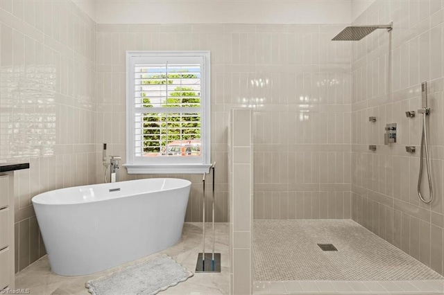 2550 Mountain Lake Rd, Asheboro, NC 27205 - bathroom featuring tiled shower, a freestanding bath, and marble finish flooring