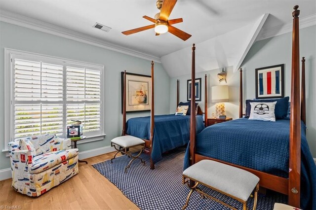 2550 Mountain Lake Rd, Asheboro, NC 27205 - bedroom with wood finished floors, crown molding, ceiling fan, and vaulted ceiling