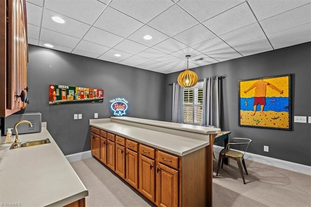 2550 Mountain Lake Rd, Asheboro, NC 27205 - kitchen with light carpet, light countertops, brown cabinets, recessed lighting, and a paneled ceiling