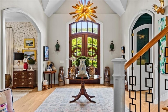 2550 Mountain Lake Rd, Asheboro, NC 27205 - foyer entrance with wood finished floors, lofted ceiling, stairs, and arched walkways