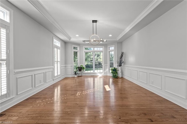 8501 Julina Dr, Oak Ridge, NC 27310 - unfurnished dining area featuring a chandelier, plenty of natural light, a tray ceiling, hardwood / wood-style flooring, and recessed lighting