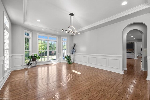 8501 Julina Dr, Oak Ridge, NC 27310 - unfurnished dining area with wood-type flooring, a decorative wall, wainscoting, crown molding, and recessed lighting