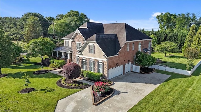 8501 Julina Dr, Oak Ridge, NC 27310 - view of front of home featuring driveway, an attached garage, and brick siding