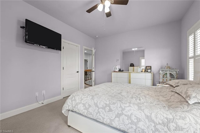 8501 Julina Dr, Oak Ridge, NC 27310 - carpeted bedroom with baseboards and a ceiling fan