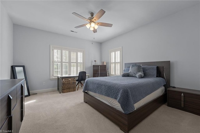 8501 Julina Dr, Oak Ridge, NC 27310 - bedroom featuring light colored carpet, baseboards, and ceiling fan