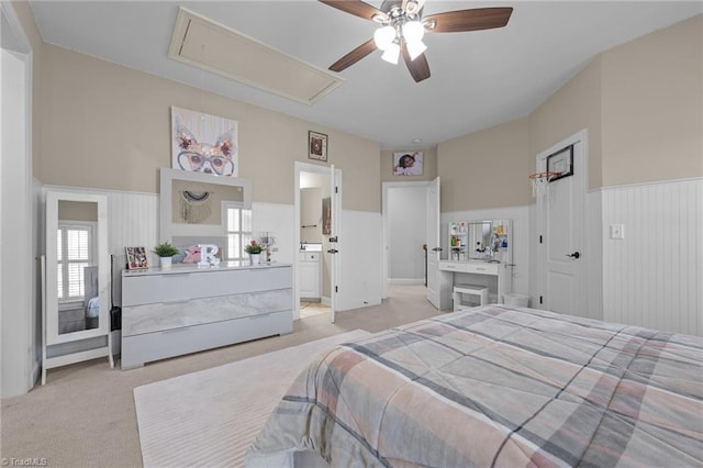 8501 Julina Dr, Oak Ridge, NC 27310 - bedroom with attic access, light colored carpet, wainscoting, and a ceiling fan