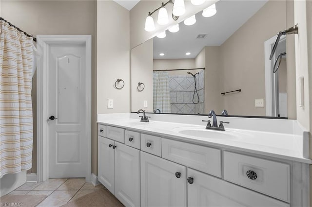 8501 Julina Dr, Oak Ridge, NC 27310 - full bathroom with tile patterned flooring, double vanity, and shower / bathtub combination with curtain