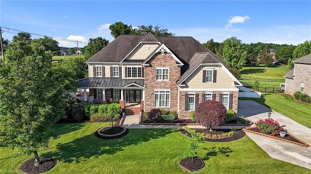 8501 Julina Dr, Oak Ridge, NC 27310 - craftsman inspired home with stone siding, covered porch, and driveway