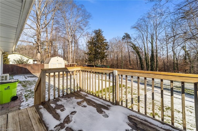 wooden deck featuring a shed