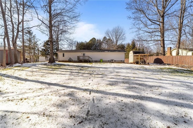 back of property with a storage unit