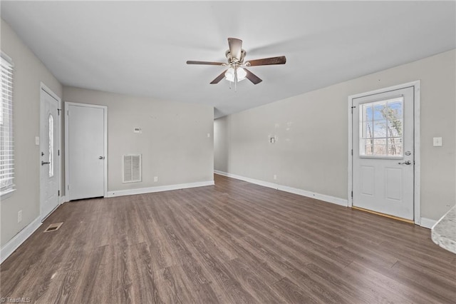 unfurnished living room with ceiling fan and dark hardwood / wood-style floors