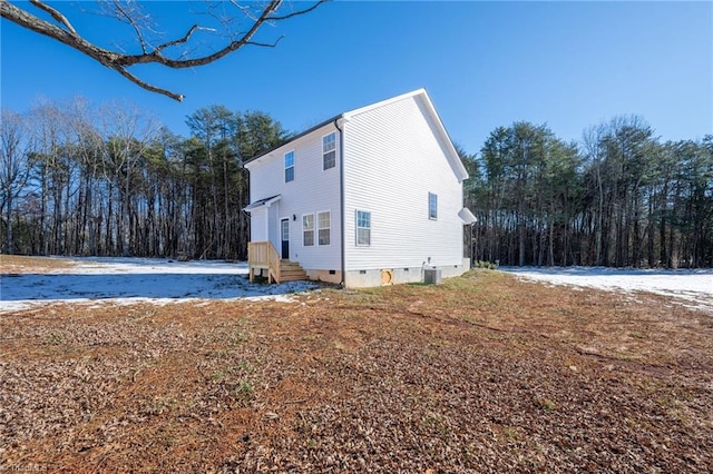 view of home's exterior with central AC unit