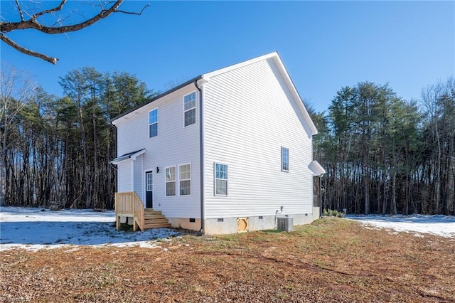 rear view of house with central AC