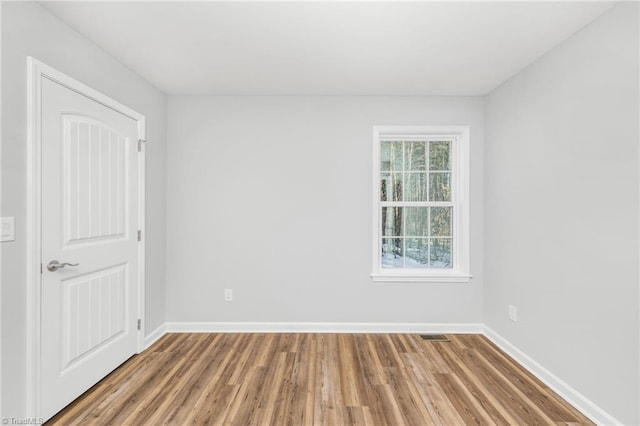 spare room featuring hardwood / wood-style flooring