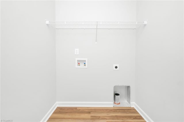 washroom with hardwood / wood-style flooring, hookup for a washing machine, and hookup for an electric dryer