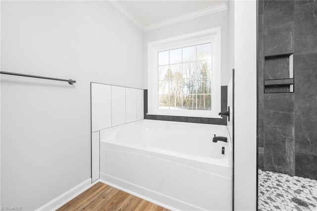 bathroom with hardwood / wood-style flooring, crown molding, and plus walk in shower