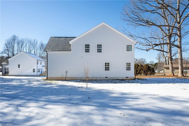 view of snow covered house