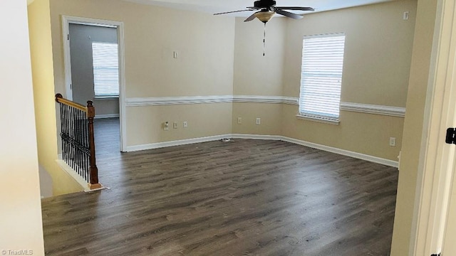 unfurnished room with dark hardwood / wood-style floors and ceiling fan