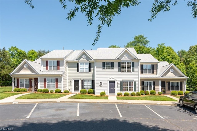 view of property with uncovered parking
