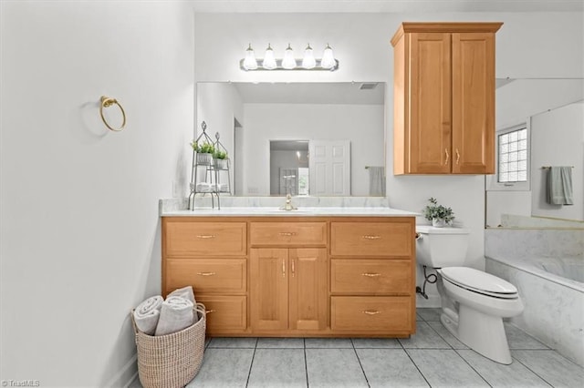 full bath with a bathing tub, toilet, vanity, tile patterned flooring, and visible vents