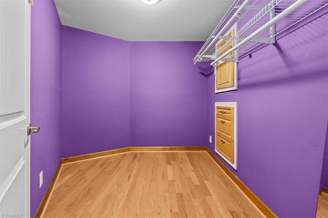 spacious closet with wood finished floors