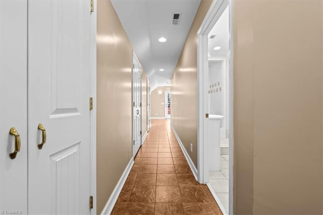 corridor featuring recessed lighting, baseboards, and visible vents