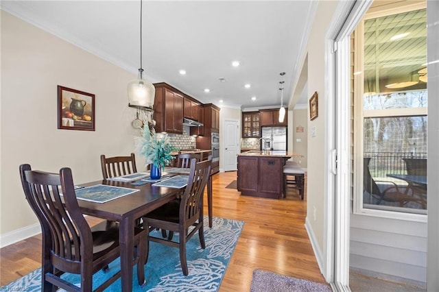 dining area with recessed lighting, baseboards, light wood-type flooring, and ornamental molding