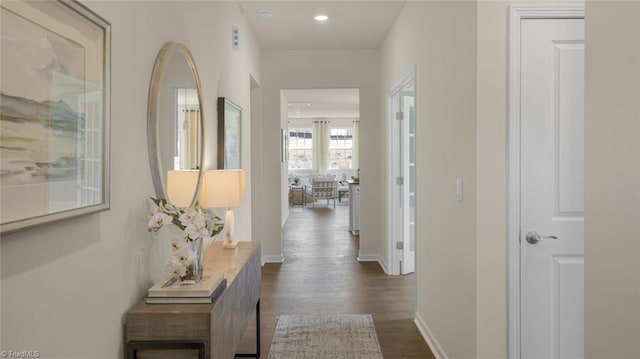 corridor with dark hardwood / wood-style floors