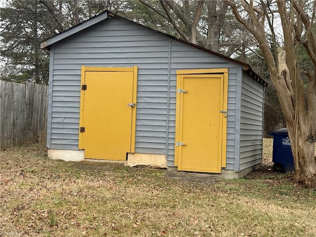 view of outdoor structure featuring a lawn