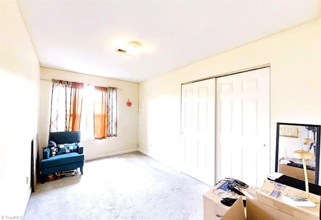 sitting room featuring carpet flooring, baseboards, and visible vents