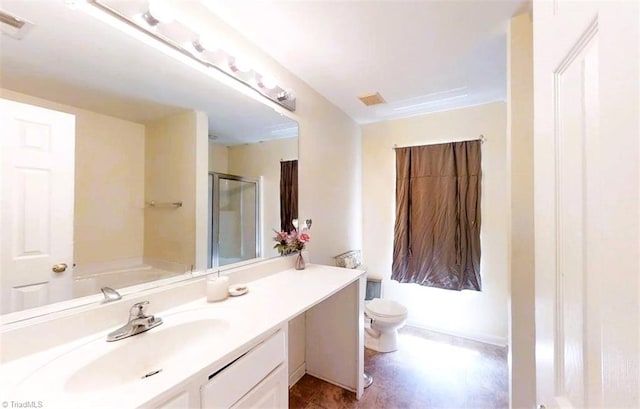 full bath featuring vanity, a shower stall, toilet, and visible vents