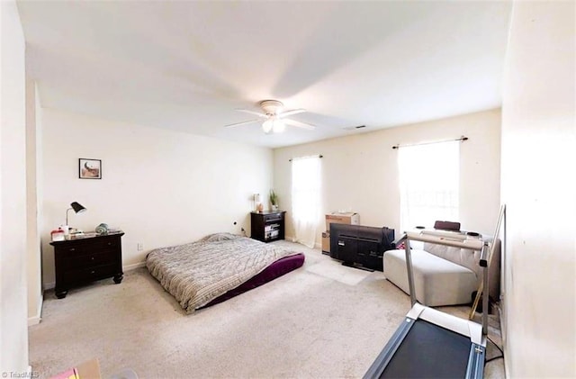bedroom featuring carpet floors, ceiling fan, and visible vents