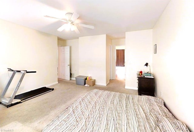 carpeted bedroom featuring baseboards and a ceiling fan