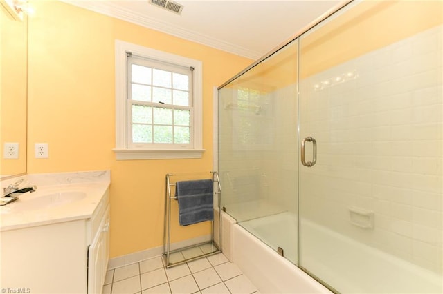 bathroom with visible vents, crown molding, tile patterned floors, vanity, and enclosed tub / shower combo