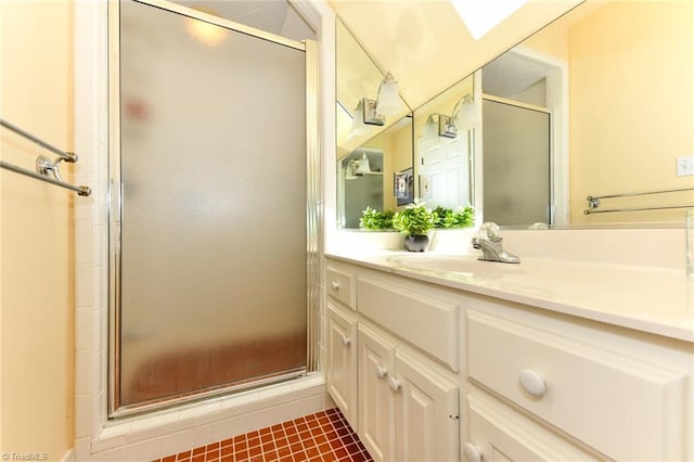 bathroom featuring a stall shower and vanity